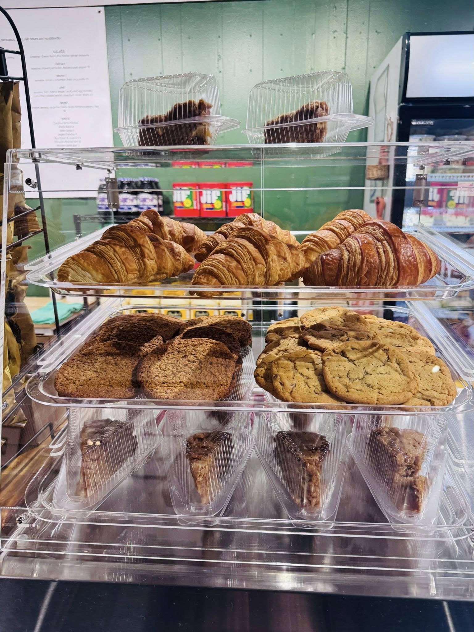 Bakery case of croissants, cookies and sweets at Roberts Market