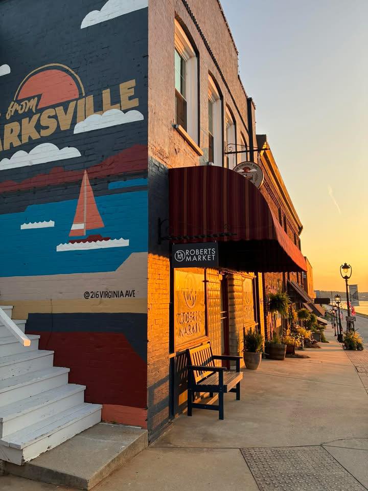 Roberts Market storefront at golden hour with the Clarksville mural