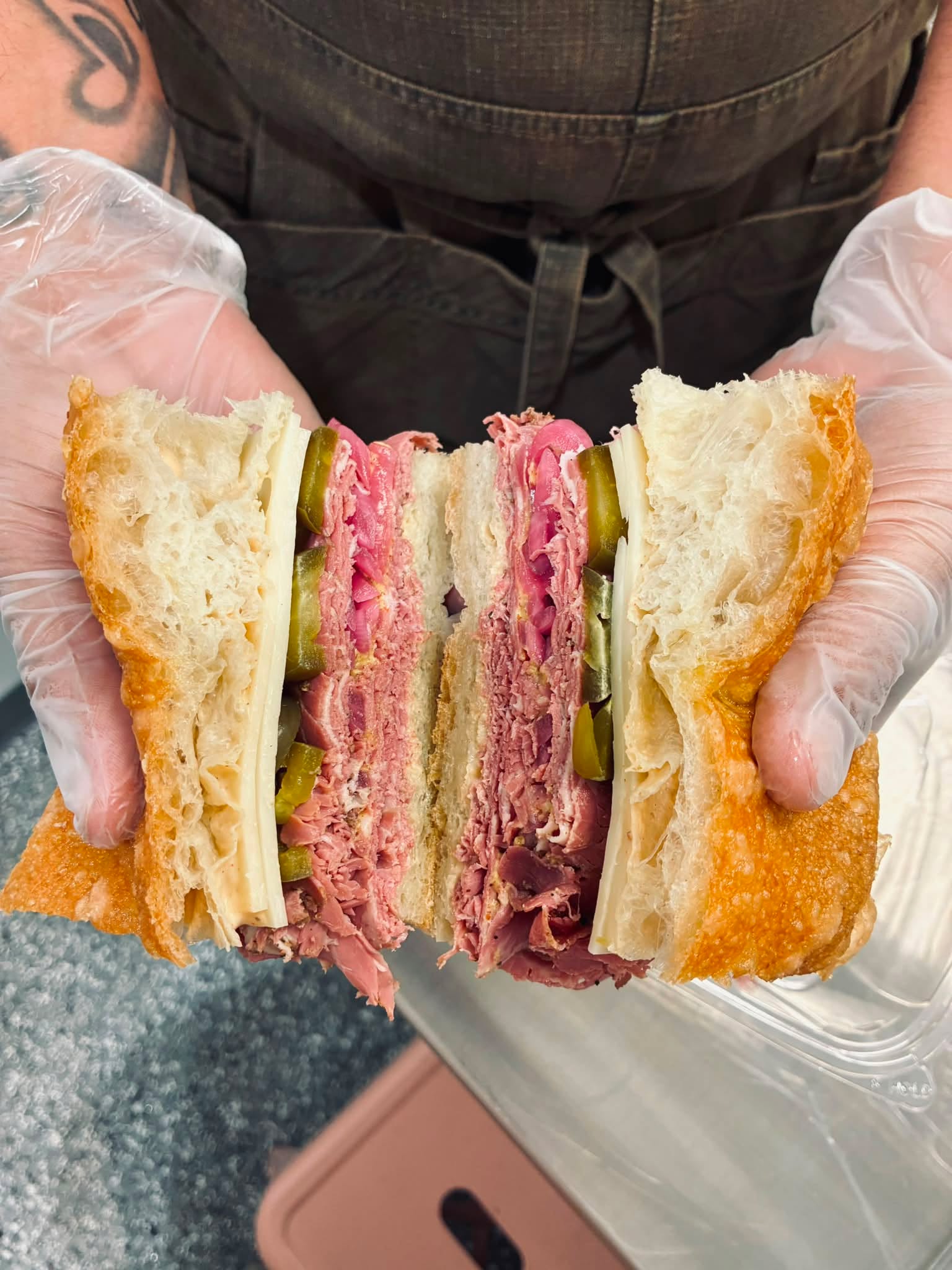 Join me in welcoming our •••L(ong)L(ost)C(ousin)••• to RM!🧳 Our LLC brings a lot to the table, so we hope he’s here to stay! •pastrami, swiss, pickled onions & jalapenos piled high